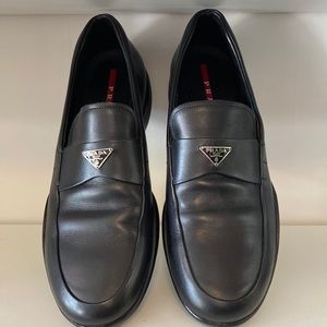 Prada Triangle logo black slip ons